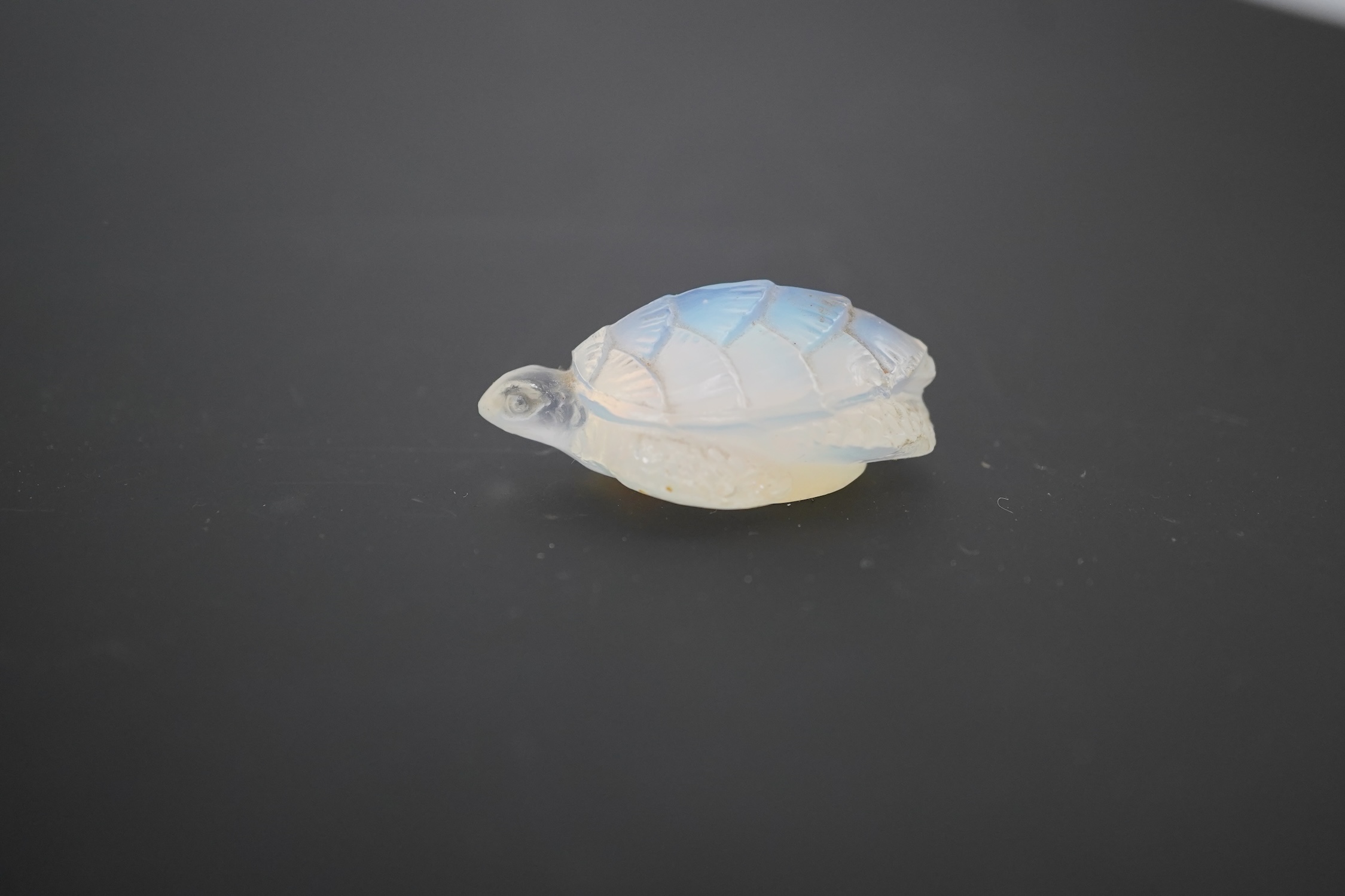 An R. Lalique opalescent glass bird paperweight and a Sabino turtle, Lalique bird high 7cm. Condition - Lalique tail slightly chipped